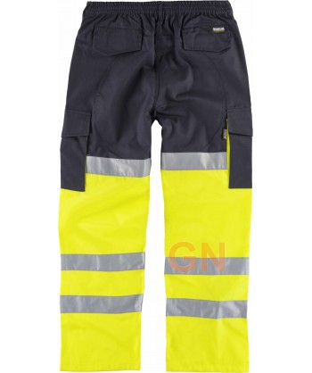Pantalón bicolor multibolsillos, con refuerzos y alta visibilidad color amarillo flúor y marino