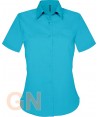 Camisa de manga corta con bolsillo para mujer. Color turquesa