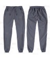 Pantalón sanitario con tejido elástico y elásticos en los bajos. Color gris oscuro