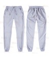 Pantalón sanitario con tejido elástico y elásticos en los bajos. Color gris claro